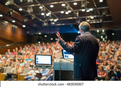 Speaker giving a talk on corporate Business Conference. Audience at the conference hall. Business and Entrepreneurship event. - Shutterstock ID 483030007
