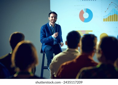 Speaker at industry event presenting advanced data analytics to group of attentive professionals in conference room. Concept of business, startup, leadership and personal development courses. - Powered by Shutterstock