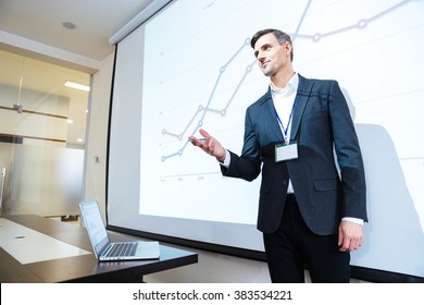 Speaker Standing And Lecturing On Business Conference In Meeting Hall