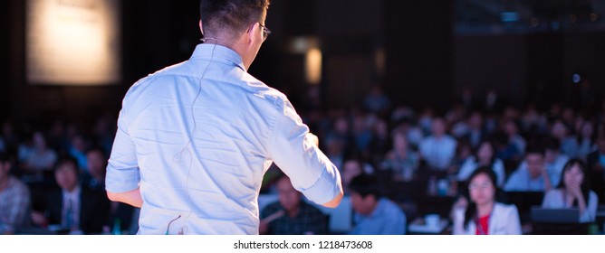 Speaker at Talk in Business Conference. Tech Executive Entrepreneur Speaker on Stage at Conference. Presenter Giving Business Presentation at Meeting. Corporate Exhibition for Investors Event.
 - Shutterstock ID 1218473608