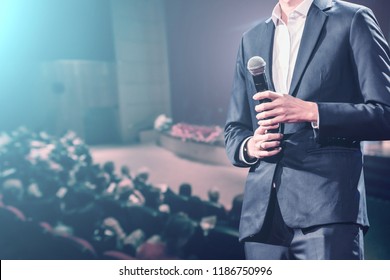 The Speaker Talking About Business Conference. Audience At The Conference Hall. Business And Entrepreneurship Event.