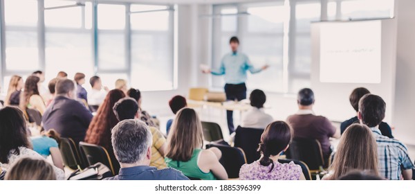 Speakers Giving a Talk at Business Meeting. Audience in the conference hall. Business and Entrepreneurship concept. - Shutterstock ID 1885396399