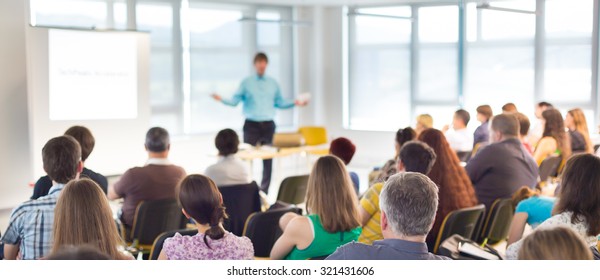 Speakers Giving a Talk at Business Meeting. Audience in the conference hall. Business and Entrepreneurship concept. - Shutterstock ID 321431606