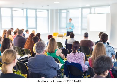 Speakers Giving a Talk at Business Meeting. Audience in the conference hall. Business and Entrepreneurship concept. - Shutterstock ID 321431648
