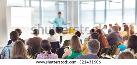 Speakers Giving a Talk at Business Meeting. Audience in the conference hall. Business and Entrepreneurship concept.
