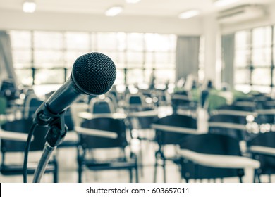 Speaker's Microphone In Educational Event, Conference Lecture Hall Or Seminar Meeting Room With Audience Or School Student