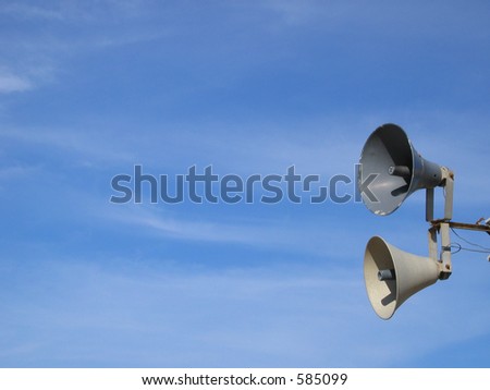 Speakers with sky/clouds background