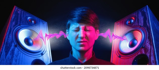 Speakers With Sound Wave In Neon Light And Woman Portrait. Discomfort From Listening To Loud Music. Hearing Damage Concept.