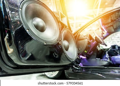 Speakers in a sport car in the sunlight