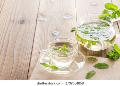 Spear Mint Tea And Tea Pod On The Table With Copy Sapce