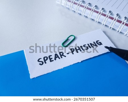 Spear - phising writting on table background.