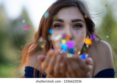 Spearfish, South Dakota/United States-September 16, 2018: College Grad Blowing Confetti After Graduating From Black Hills State University