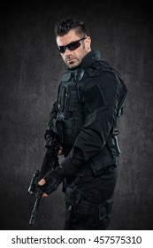 Spec Ops Police Officer SWAT In Black Uniform Studio