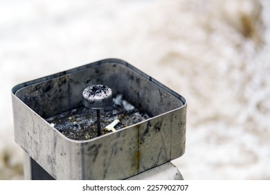 Special ashtray with elevation in the center for extinguishing cigarette butts - Shutterstock ID 2257902707