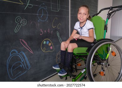 Special child on wheelchair. Girl in school uniform on the background of the school board.