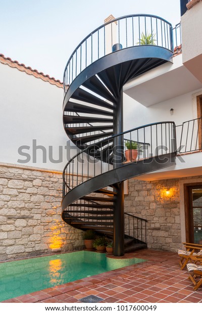 Special Design Black Metal Stair with Swimming\
Pool. Stairway, staircase, stairwell, flight of simply stairs\
construction design to bridge large vertical distance by dividing\
it into smaller\
vertical.