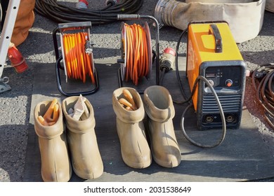 Special dielectric rubber boots and gloves designed to work with high voltage.High voltage protective insulating shoes and gloves