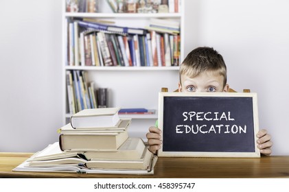 Special Education. Boy Holding Blackboard