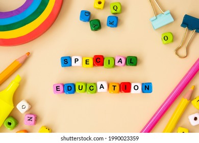 Special Education Words, Child Care, Disability Concept. Colorful Office Suplies Flat Lay, Wooden Cubes