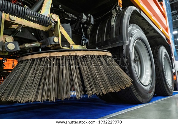 Special equipment for street cleaning. Fragment\
of a street sweeping machine. Car brushes for cleaning asphalt.\
concept - cars of city services. Machine vacuum cleaner for\
cleaning streets.