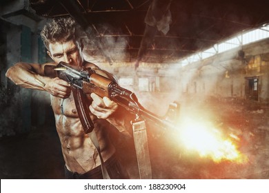 Special Force Man With The Assault Rifle Gun In Battle