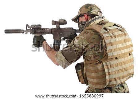 special force operator with assault rifle isolated on white