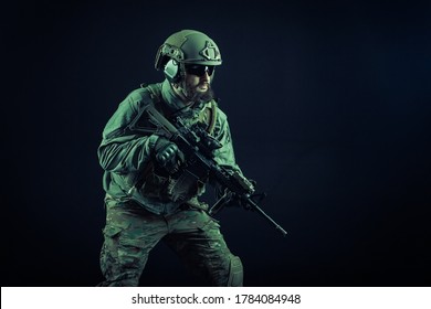 special forces attack, soldier in uniform with a rifle in action, american ranger with guns, airsoft concept