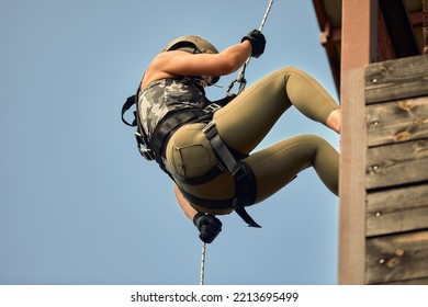 Special Forces Fighter Descends From A Skyscraper To Storm The Apartment. Police, Counter Terrorism Concept. Mixed Media