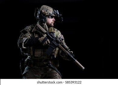 Special Forces Soldier In Helmet With Night Vision Device And Rifle On Dark Background/Spec Ops Soldier SWAT