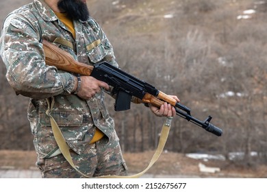 Special Forces Soldier Holding Hand Gun
