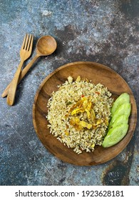 Special Kaempferia Galanga, Nasi Goreng Kencur Fried Rice Served With Eggs And Slices Of Cucumber. Famous Food In Malaysia  And Indonesia. It Taste Spice And Ready To Eat. 