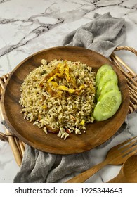 Special Kaempferia Galanga, Nasi Goreng Kencur Fried Rice Served With Eggs And Slices Of Cucumber. Famous Food In Malaysia And Indonesia. It Taste Spice And Ready To Eat. 