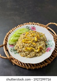 Special Kaempferia Galanga, Nasi Goreng Kencur Fried Rice Served With Eggs And Slices Of Cucumber. Famous Food In Malaysia And Indonesia. It Taste Spice And Ready To Eat. 