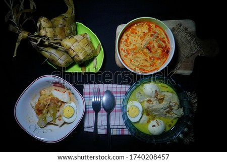 Special menu in Java, Indonesia when Eid Festival come: Opor Ayam, Sambal Goreng and Ketupat, strobist and night photography, selective focus, so Contrast, so grainy 