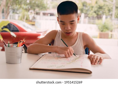 Special Need Child On Wheelchair Writing Practice In Home On Garden Nature Background,Life In Education Of Disabled Kid, Concept Of People Doing Art Hobbies With Home School And Happy Disability Boy.