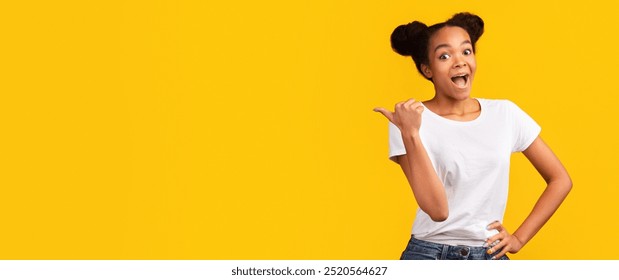 Special Offer. Enthusiastic black teen girl pointing to the side with thumb up. Panorama, free space