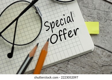 special offer text on a notebook page. near the pencils - Shutterstock ID 2223052097