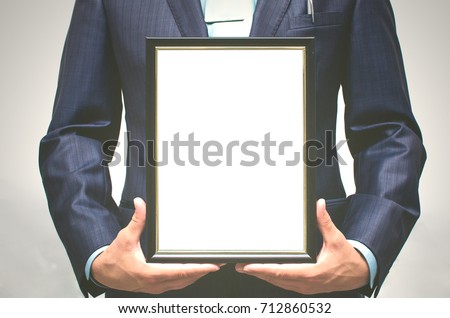 Special offer. Top manager award mockup. Best office employee award. Business man holding in hands empty blank photo frame. Gratitude concept. Grateful letter.