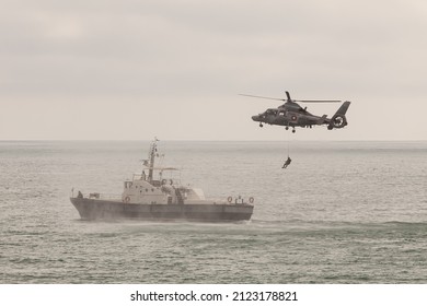 Special operations forces training. Military helicopter over ship. - Powered by Shutterstock