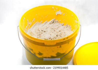 A Special Paste For Cleaning Hands From Dirt As A Result Of Working With Industrial Equipment And Printing Ink. Hand Cleaner In A Bucket. Selective Focus.