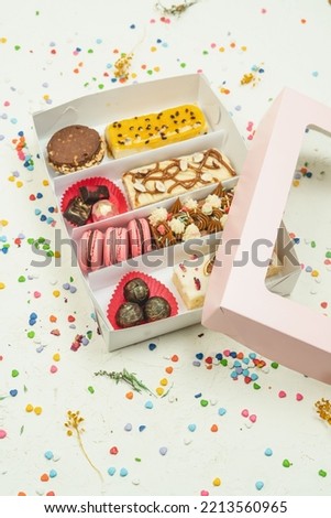 Special pastry box to give to a woman,mother. bring chocolates, macarons and cake Zdjęcia stock © 