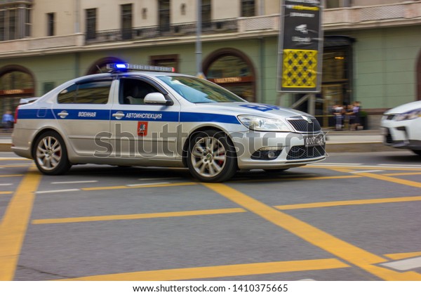 Special police car\
goes to the crime scene\
 \
Photo taken at Theatre square, Lubyanka\
metro station, spring 2019, Moscow, Russia, car, road, buildings,\
special transport