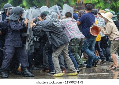 Special police unit with shields against protesters,Protester Pushes Police Riot Shields at a Political Rally. - Shutterstock ID 1199924173