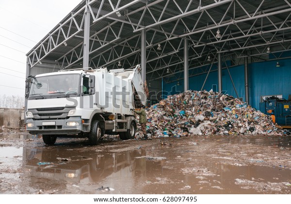 A special
truck unloads waste. Transportation of waste. Technological
process. Recycling and storage of waste for further disposal.
Business for sorting and processing of
waste.