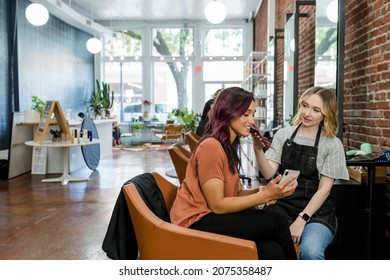 Specialist advising the customer suitable hairstyle - Shutterstock ID 2075358487