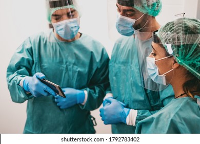 Specialist doctors fighting against corona virus outbreak - Science and medical teamwork examining pandemic cases graphic - Healthcare and covid-19 emergency concept - Powered by Shutterstock