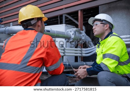 A specialist engineer and an inspector are working together to find faults that are causing the water supply system to supply insufficient water.