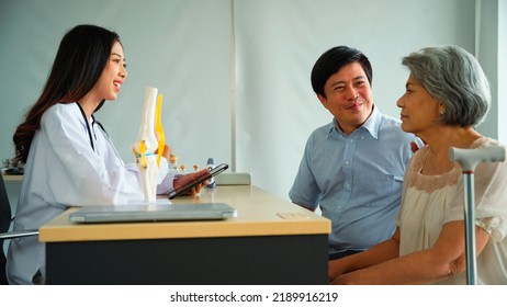 Specialist Female Doctor Is Introducing A Treatment Program To Patients To Maintain The Health Of The Old Woman Back To Being Strong As Before. Son Of A Female Patient Encourages His Mother.