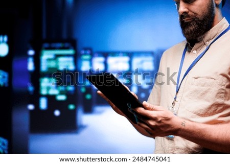 Specialist inspecting interlinked computers creating server network. Cloud computing service business using parallel computing to perform complex calculations and process large amounts of data