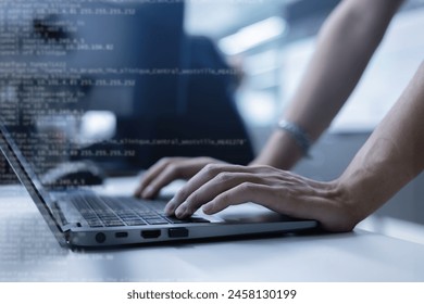 specialist programmer man hand type configuration code on at laptop for check software function for fix bug and defect of security system in dark datacenter room for engineering and technology concept